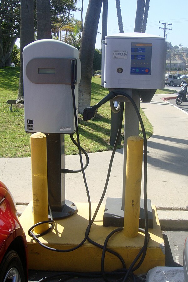 Public charging stations in a parking lot near Los Angeles International Airport. Shown are two obsolete 6 kW AC charging stations (left: inductive Ma