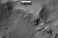 Layers along crater rim in Terra Sirenum, as seen by HiRIS under the HiWish program.