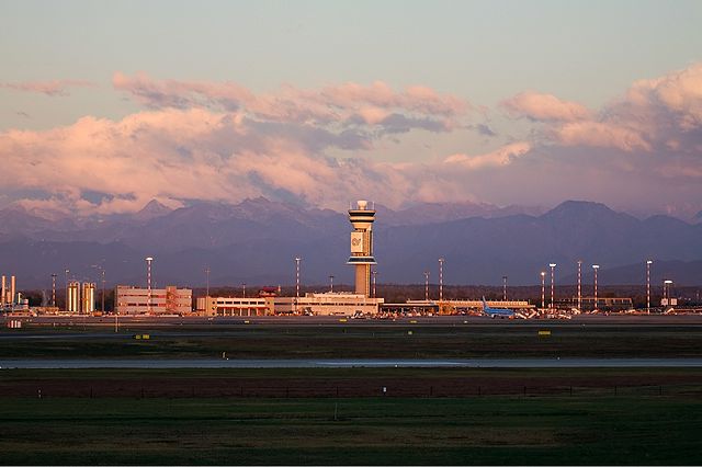 Control tower with the Italian Alps visible in the background