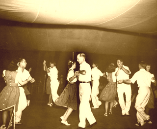 Square dance dance for four couples (eight dancers) arranged in a square