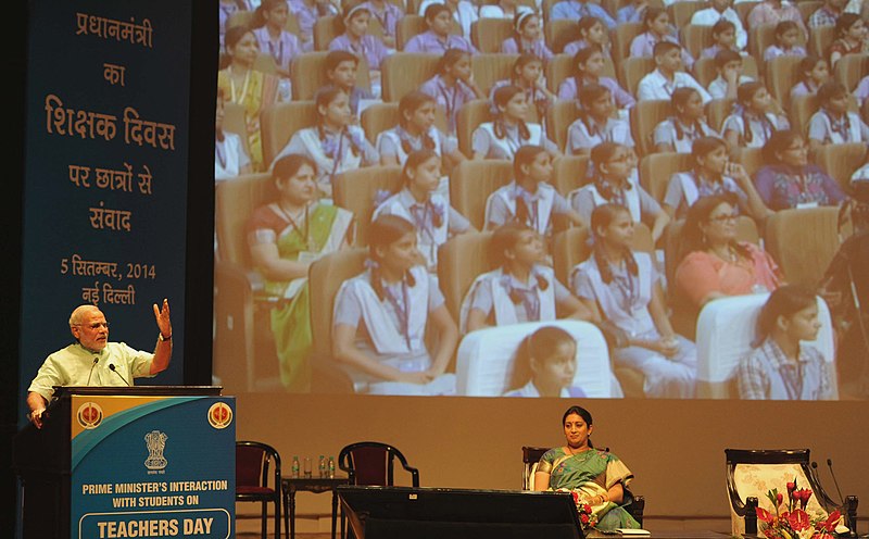 File:Narendra Modi addressing at the "Teachers' Day" function, at Manekshaw Auditorium, in New Delhi on September 05, 2014. The Union Minister for Human Resource Development, Smt. Smriti Irani is also seen (1).jpg