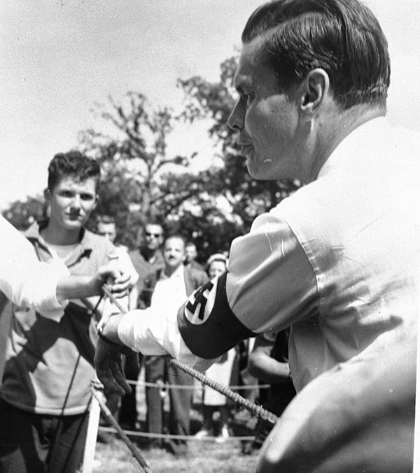 Rockwell (foreground, with swastika armband) at a rally in 1967.