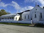 The property on which the church complex is situated was bequeathed to the London Missionary Society in 1842 by Mrs Dorothy Edwards, widow of the Rev. John Evans of Cradock. The parsonage, which was built in the Victorian style, dates from the period 1825
Type of site: Church and Parsonage.