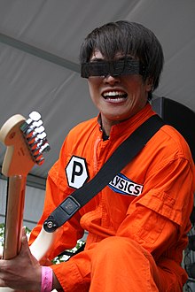 Hayashi plays Guitar at a POLYSICS live show in 2007