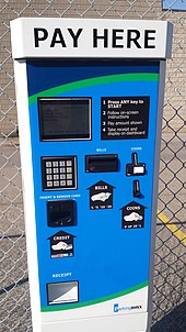 Example of a machine which accepts not only coins, but bills, credit, debit and prepaid cards. Par fee machine.jpg