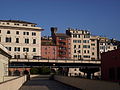 Torre degli Embriaci e la palazzata dietro piazza Cavour fotografati dalla palazzina Millo nell'area del Porto Antico. In primo piano la sopraelevata