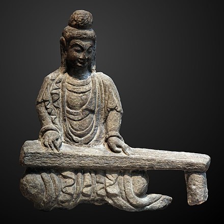 Rock carving of a bodhisattva playing a guqin, found in Shanxi, Northern Wei dynasty (386–534)