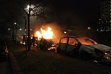 Second day of the Stockholm Husby riots. The picture shows three cars on fire in the Stockholm suburb of Husby, 20 May 2013 Second day of Husby riots, three burning cars.jpg