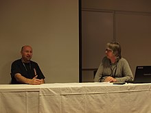 Simon Furman, the guest of honour of Auto Assembly 2011, being interviewed by Lars Eriksson, one of the organisers. Simon Furman and Groundsplitter at AAE 2011.jpg