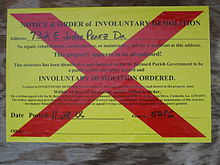 Involuntary Demolition notice, posted on buildings in St. Bernard Parish when there has been no significant effort to gut, secure, or repair the building over a year after Hurricane Katrina.