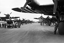 Short Stirlings of Nos. 196 and 299 Squadrons RAF lining the runway at RAF Keevil on the evening of 5 June 1944 before emplaning paratroops of the 5th Parachute Brigade Group for the invasion of Normandy.