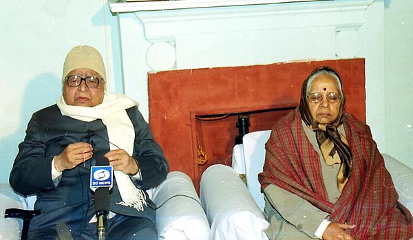 S. N. Goenka with his wife while speaking at a talk on Values in Education - Good Governance through Vipassana Meditation