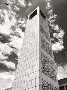 The tower that separates the east from the north wing buildings at the Uganda Parliament. this tower together with the parliament was built by the British colonial government in the late 1950s as a gift to Uganda just before it attained its independence. The tower at Uganda's parliament.jpg