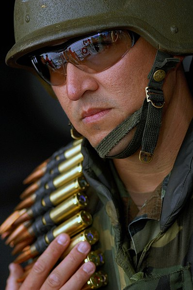 File:US Navy 070920-N-2984R-001 Chief Master-at-Arms Gabriel Martinez, assigned to Operations department aboard Nimitz-class aircraft carrier USS Harry S. Truman (CVN 75), waits his turn to load and fire a mounted .50-caliber machin.jpg