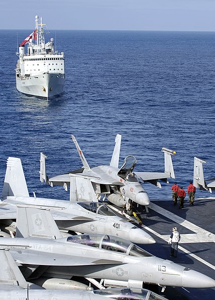 File:US Navy 091115-N-4954I-002 A group of Aviation Ordnancemen from the Blue Diamonds of Strike Fighter Squadron (VFA) 146, walk to the aft end of the flight deck to watch the Canadian navy logistics vessel HMCS Protecteur.jpg