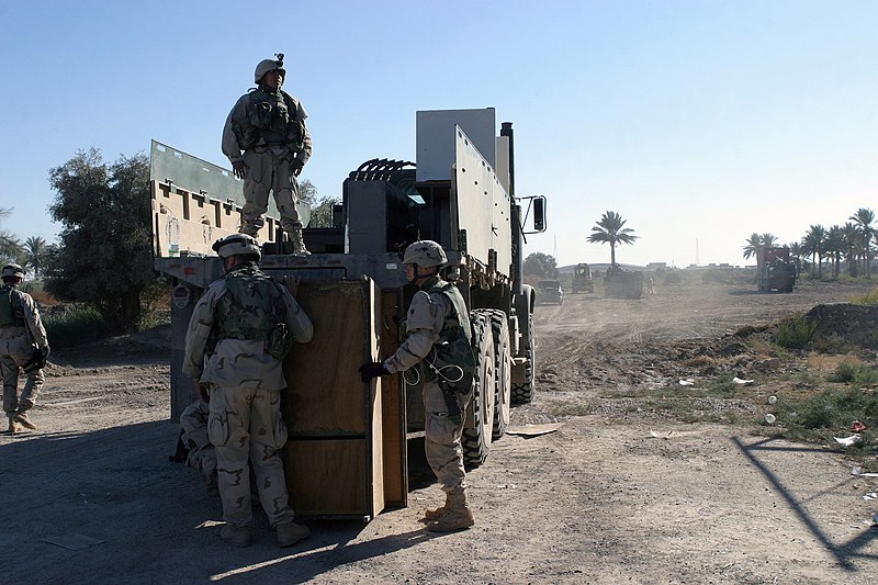 File:04 December 01- Soldiers from the 1ST Regiment 503rd Infantry Battalion load a 7-Ton truck with items that were cleaned out of one of the buildings located at an agriculture college - DPLA - e85d58fbcc3790d77730e169539f943b.jpeg