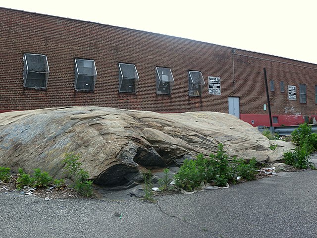 Ancient boulder, a glacial erratic, partly blocking 12th Street