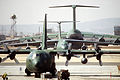 A C-130 Hercules, C-141B Starlifter and a C-5 Galaxy aircraft are parked on the Military Airlift Command flight line during Exercise Team Spirit '86 DF-ST-87-09684.jpg