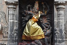 Durga in the Shivakama Sundari shrine, in her Mahishasuramardini form killing the buffalo demon below her foot. A view of Nataraja Shiva Temple at Chidambaram, Tamil Nadu (23).jpg