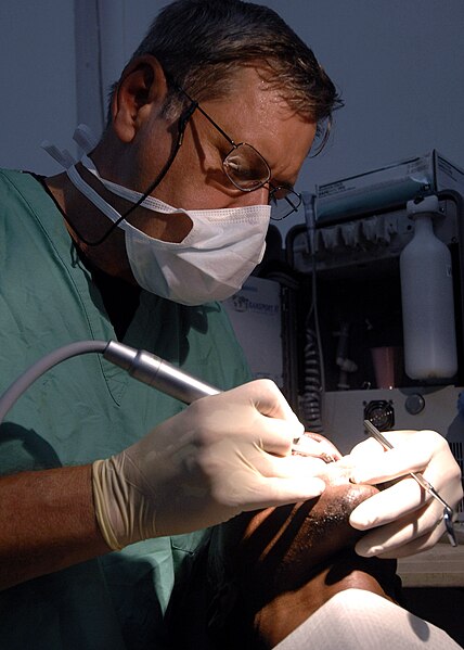 File:Air Force Lt. Col. Richard Tate, dentist, performs a tooth extraction.jpeg