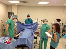 Photo of prebriefing for mixed modality simulation being used for anesthesia resident training Anesthesia Resident Simulation.jpg