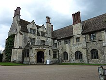 Visitor entrance at rear of house, with dining room on the right showing old masonry Anglesey Abbey 3a.jpg