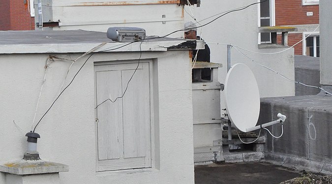 parabolic antenna with connection box, France