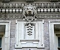 Lions above the seventh floor surround the entire building just below the original roof line.