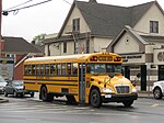 An Atlantic Express school bus operates through Oceanside, New York.