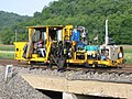 A BNSF spiker at work in Prairie du Chien, Wisconsin