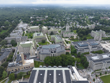 Aerial view of the Chestnut Hill main campus. Boston College campus aerial from above (Quintin Soloviev).png