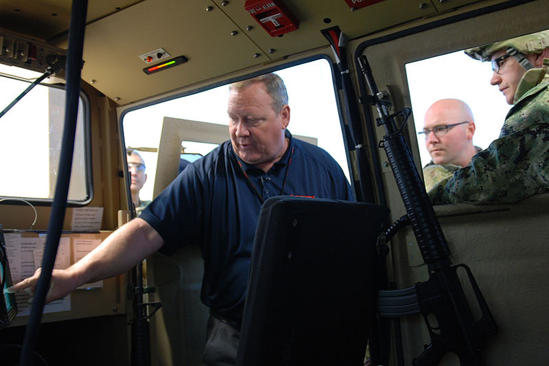 File:Bret Bussman, left, a principal training and development specialist for the Reconfigurable Vehicle Tactical Trainer, explains the virtual training program to Service members in the National Guard Bureau Joint 130313-A-NT154-093.jpg