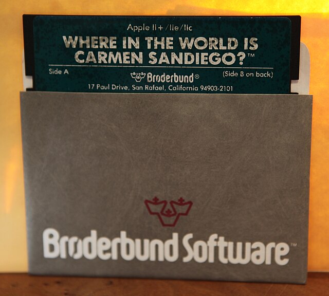 A copy of the 1985 video game Where in the World Is Carmen Sandiego? in 5¼-inch floppy disk format for the Apple II Plus personal computer, with the f