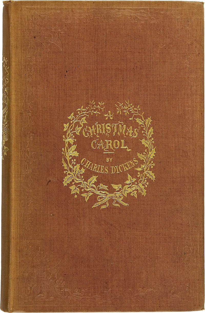 Brown book cover bearing the words "A Christmas Carol by Charles Dickens" in gold.