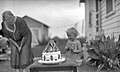 Child with Snow White cake 1910-1940.jpg
