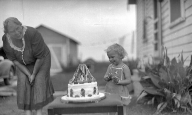Child with Snow White cake, circa 1910–1940.