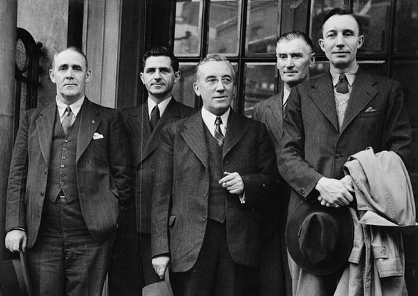 Four past and future National Chairmen in September 1944: National CCF delegation attending the Conference of Commonwealth Labour Parties in London, England. Pictured from left to right: Clarie Gillis, MP for Cape Breton South; David Lewis, National Secretary; M. J. Coldwell, National Leader, MP for Rosetown—Biggar; Percy E. Wright, MP for Melfort; and Frank Scott, national chairman.