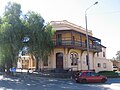 Bed and Breakfast, was built in 1884 as the Bank of Australasia. Two Pepper trees stand in front.