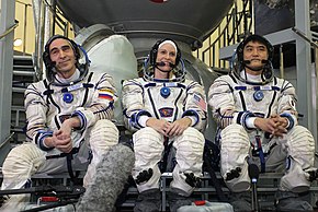 Expedition 46 backup crew members in front of the Soyuz TMA spacecraft mock-up in Star City, Russia.jpg