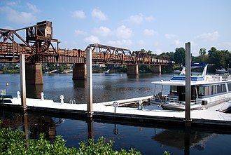 The Fifth Street Marina on Riverwalk Augusta with the Sixth Street Train Trestle in the background. Fifth Street Marina in Augusta, GA.jpg