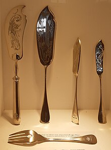 Four kinds of fish knife (two left ones are for serving) and a fish fork for Lloyd Triestino First Class dining (1931) Four kinds of fish-knife for First Class Lloyd Triestino passengers.jpg