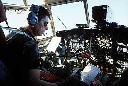 Commander-in-Chief of The Military Airlift Command General Thomas M. Ryan Jr., piloting a U.S. Air Force Lockheed C-130 Hercules aircraft en route from Barbados to Grenada, November 1983.