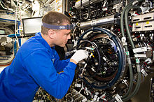 Wiseman working in the Destiny module of the ISS in August 2014 ISS-40 Reid Wiseman on the Multi-user Drop Combustion Apparatus in the Destiny lab.jpg