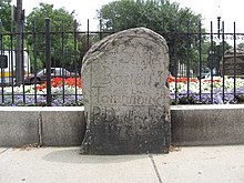 This milestone marking five miles (8 km) from the Boston Town House (now the site of the Old State House in downtown Boston) was placed on Centre Street by Paul Dudley in 1735.