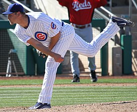 Chicago Cubs pitcher Kerry Wood's son, Justin, comes onto the field to  greet him after his final appearance in the eighth inning against the  Chicago White Sox at Wrigley Field in Chicago