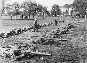 Soldiers on a firing line operating Lewis guns