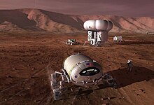 DRMA 5.0 "commuter" Mars base, featuring a pressurized rover for two, with a 5 kilowatt Stirling radioisotope generator for power. Manndmissiononmarsnasa.jpg