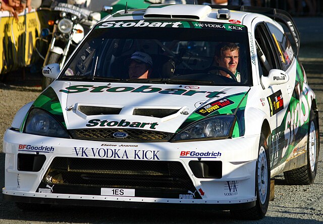 Wilson at the 2006 Cyprus Rally. Note that the car is named Elaine Joanne, following sponsor Stobart Group's tradition of giving its lorries female na