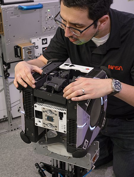 File:NASA's Jose Cortez checks fit of Astrobee's robot arm (ACD19-0009-027).jpg