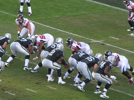Russell (#2) taking the snap versus the Atlanta Falcons.